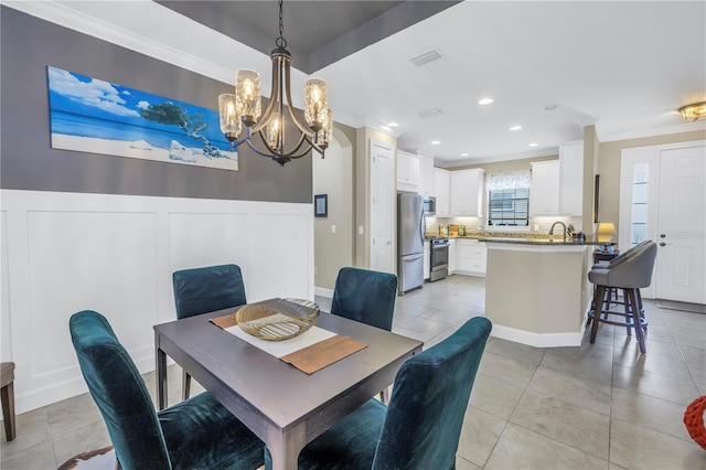 10446 Highland Park Pl, Palmetto, FL 34221 - dining area with a chandelier, ornamental molding, light tile patterned floors, and recessed lighting
