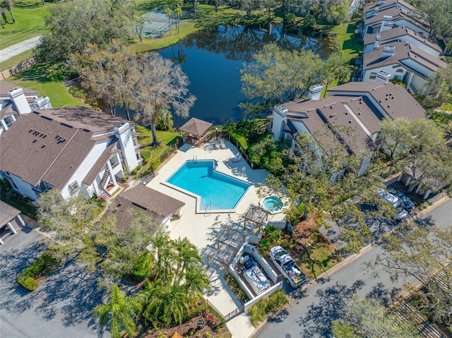 birds eye view of property with a water view and a residential view