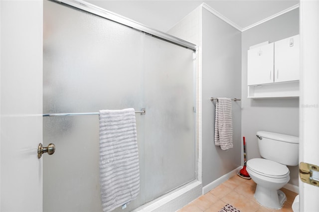 full bath with ornamental molding, tile patterned flooring, a shower stall, and toilet