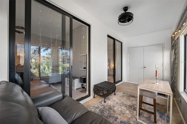 tiled living area featuring plenty of natural light