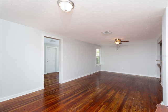 spare room featuring ceiling fan, a textured ceiling, wood-type flooring, and baseboards