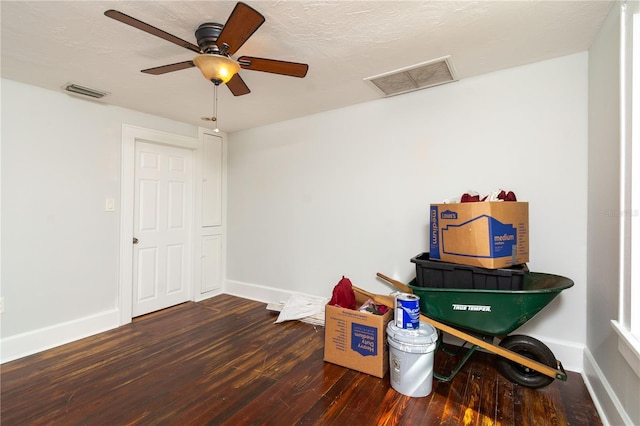 misc room with visible vents, baseboards, and wood finished floors