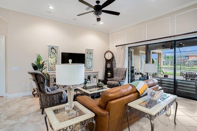 living room featuring crown molding, recessed lighting, a ceiling fan, light tile patterned flooring, and baseboards