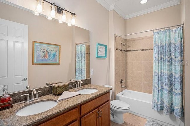 bathroom with tile patterned flooring, shower / bath combo, ornamental molding, and a sink