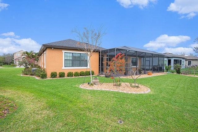 view of front of house featuring a lanai, stucco siding, and a front yard