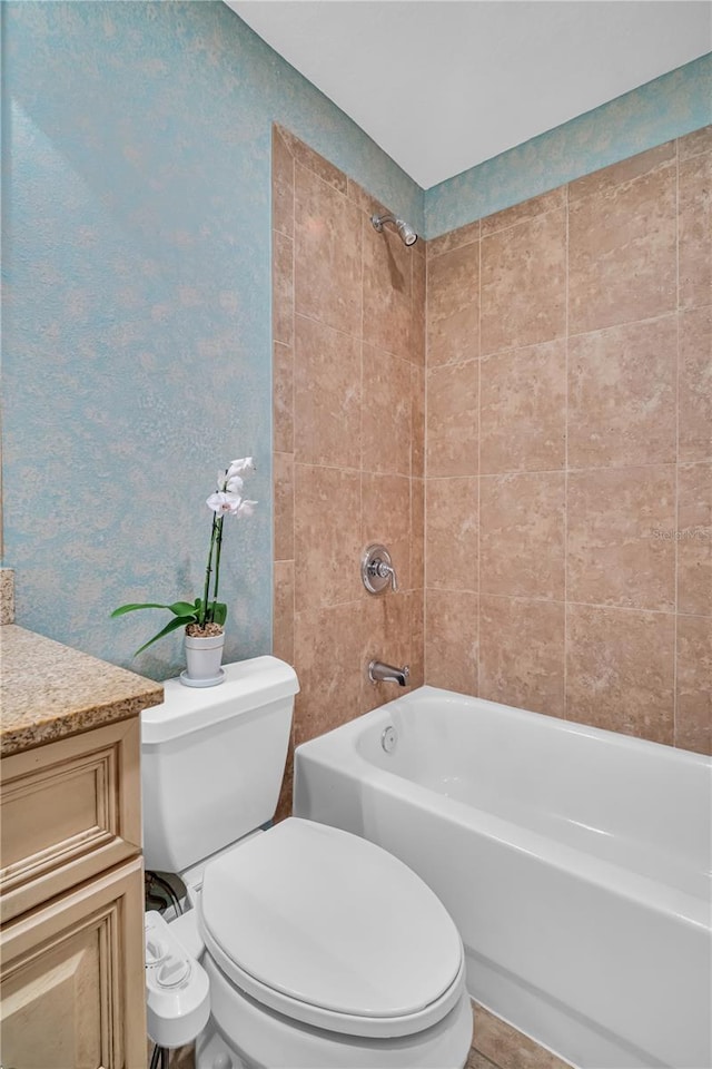 full bathroom featuring  shower combination, vanity, and toilet