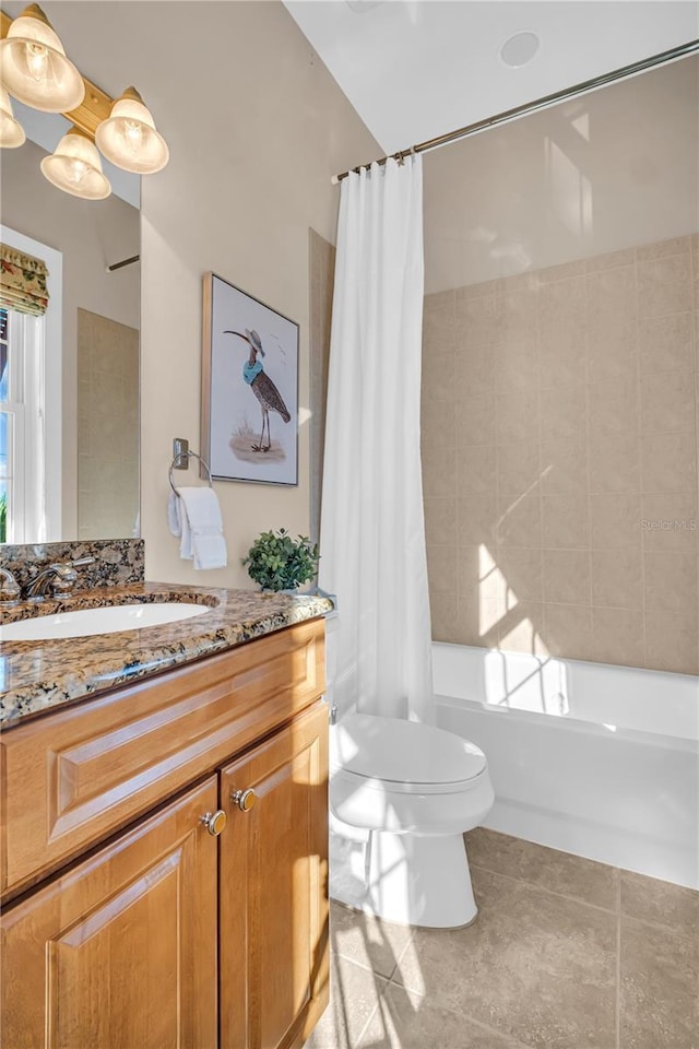 bathroom with shower / tub combo, vanity, toilet, and tile patterned floors