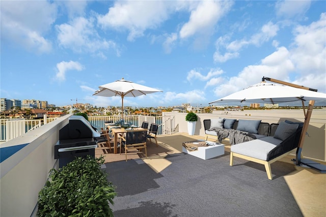 view of patio / terrace with an outdoor living space with a fire pit