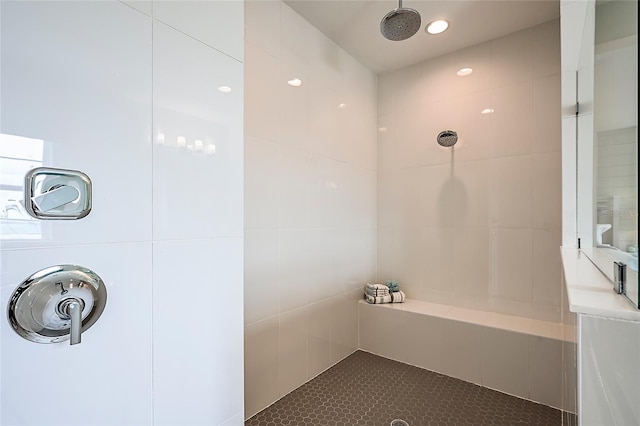 full bath featuring a tile shower