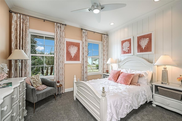 bedroom with carpet floors, crown molding, baseboards, and ceiling fan