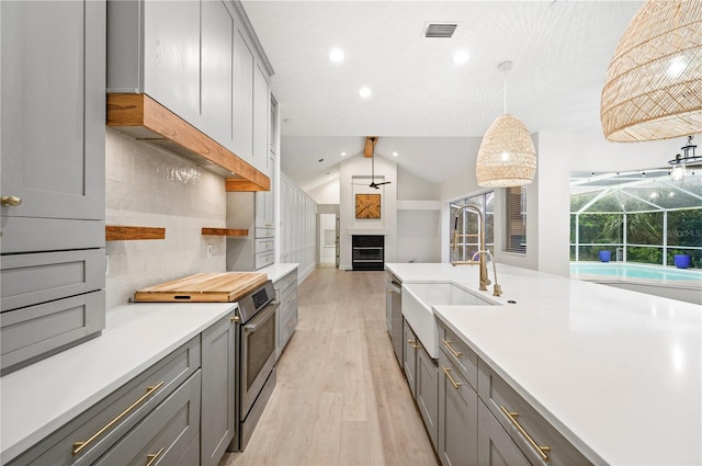 kitchen with gray cabinetry, visible vents, and stainless steel electric stove