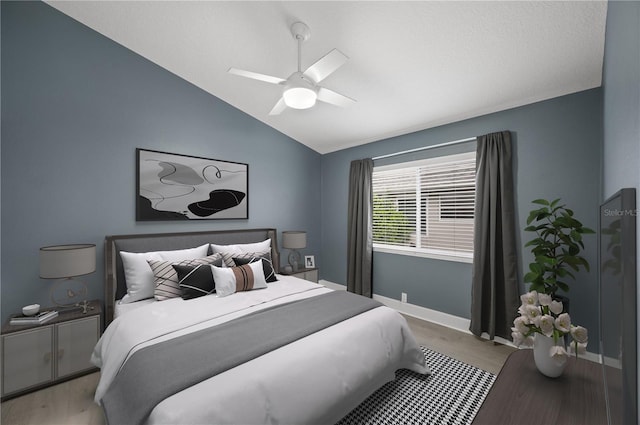 bedroom featuring vaulted ceiling, ceiling fan, and baseboards