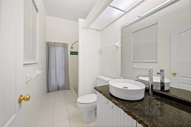 bathroom with toilet, tile patterned flooring, vanity, and a shower with shower curtain