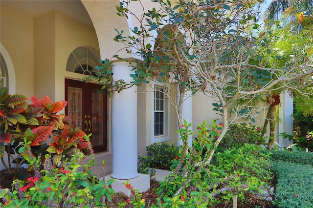 doorway to property with stucco siding