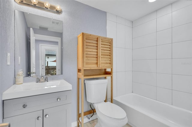 bathroom featuring toilet, visible vents, and vanity