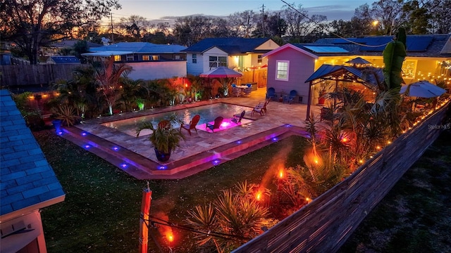 exterior space with a fenced backyard, a fenced in pool, and a patio