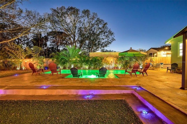 view of jungle gym with a patio, a fenced backyard, and a fenced in pool