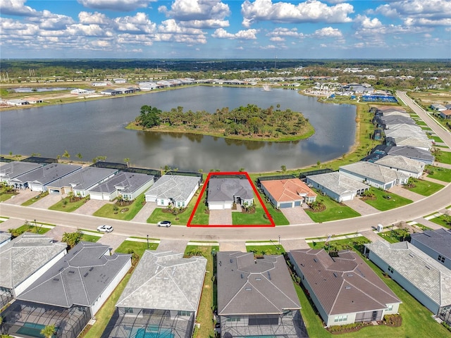 birds eye view of property featuring a water view and a residential view