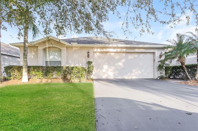 single story home featuring an attached garage, a front lawn, concrete driveway, and stucco siding