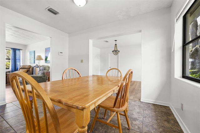 dining area with baseboards and visible vents