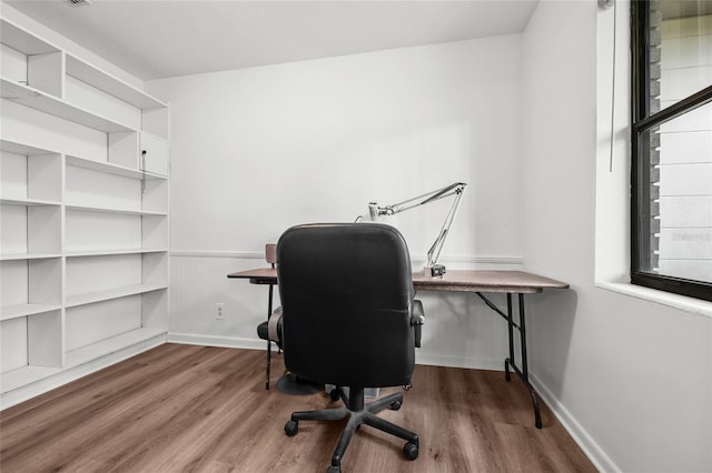 office with wood finished floors and baseboards