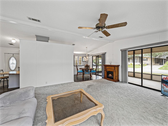 living room with lofted ceiling, visible vents, crown molding, and a textured ceiling