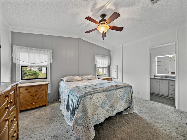 bedroom with carpet flooring, crown molding, a textured ceiling, and multiple windows