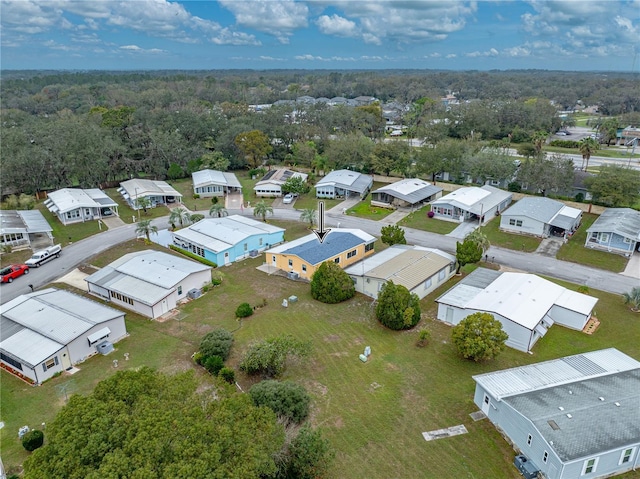 birds eye view of property with a residential view and a forest view