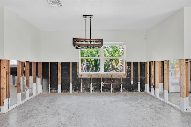 unfurnished living room featuring visible vents