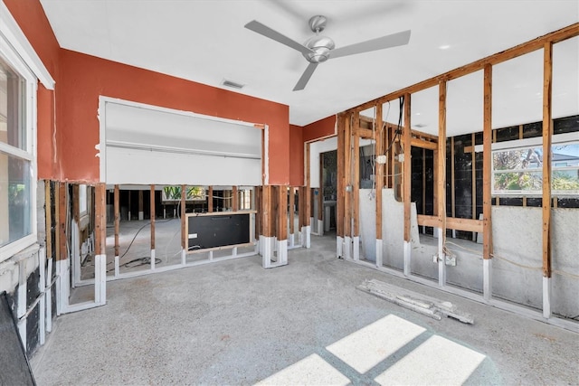 interior space with visible vents and a ceiling fan