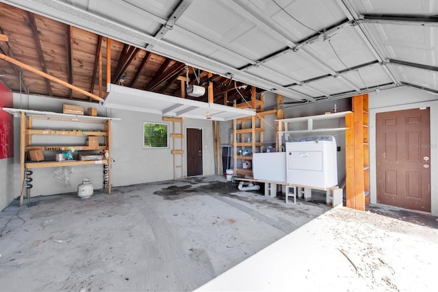 garage featuring washer / clothes dryer and a garage door opener