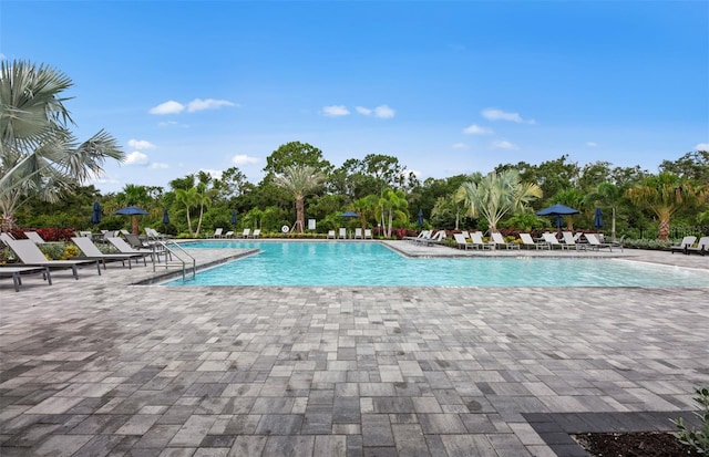 community pool with a patio area