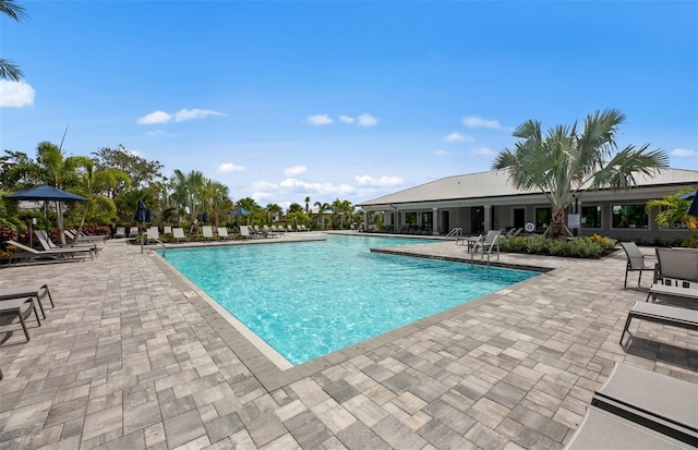 community pool with a patio area