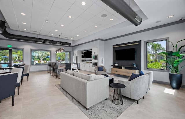 living room with recessed lighting, visible vents, and baseboards