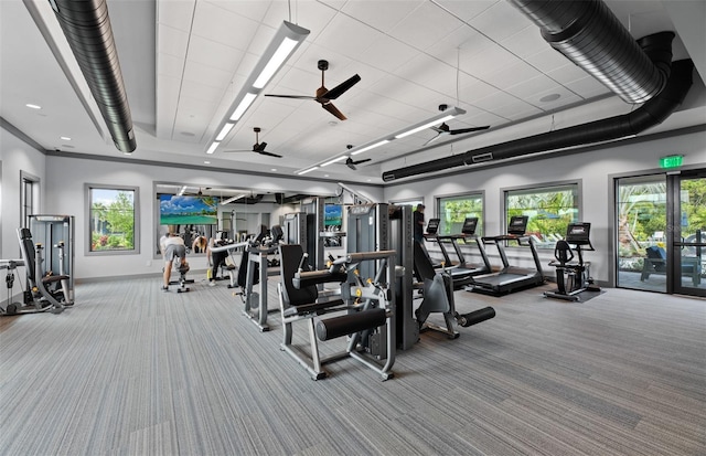 exercise room featuring french doors, carpet, a ceiling fan, and baseboards