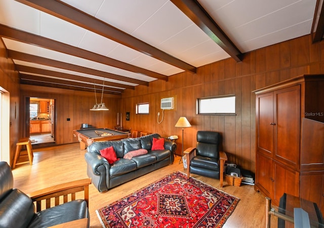 living area featuring wooden walls, pool table, light wood-style floors, beam ceiling, and a wall mounted AC