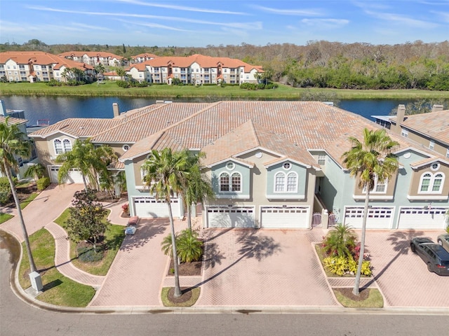 bird's eye view with a water view and a residential view