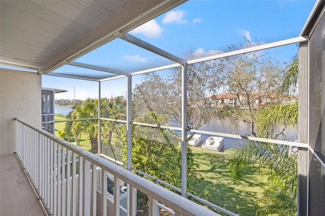 unfurnished sunroom with a water view