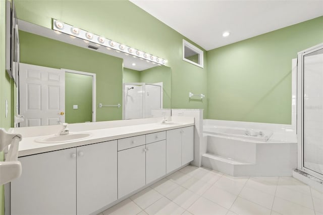 full bath featuring a garden tub, a sink, tile patterned floors, double vanity, and a stall shower