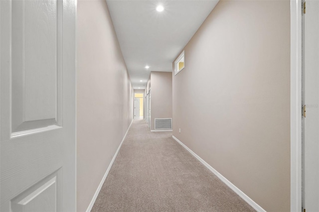 hallway featuring baseboards, visible vents, carpet flooring, and recessed lighting