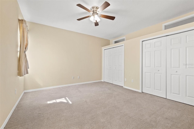 unfurnished bedroom featuring carpet floors, ceiling fan, and baseboards