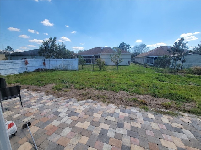 view of yard featuring a patio area and a fenced backyard