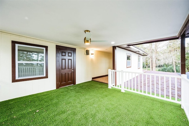 doorway to property with a lawn