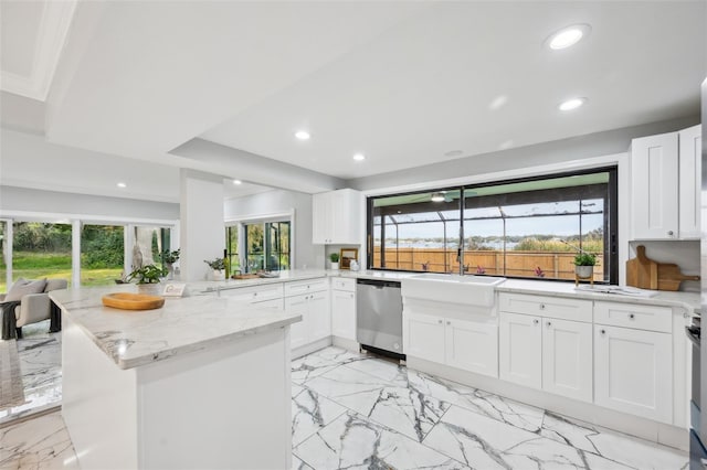 kitchen with recessed lighting, dishwasher, a peninsula, and light stone countertops