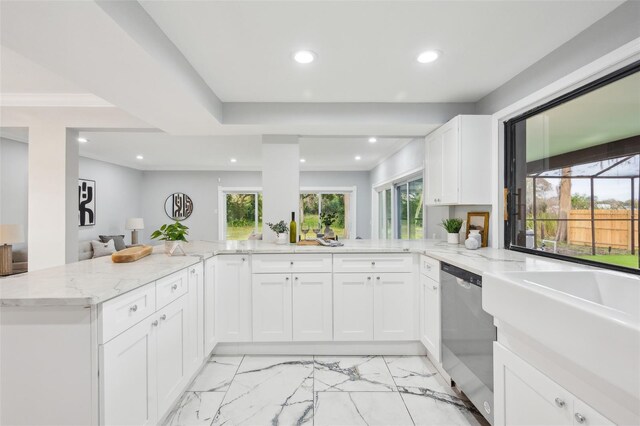 kitchen featuring stainless steel dishwasher, white cabinetry, light stone counters, and recessed lighting