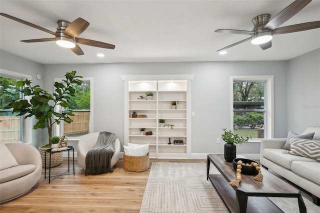 living room with ceiling fan, baseboards, wood finished floors, and recessed lighting