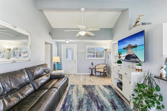 living room featuring light wood-style floors, visible vents, baseboards, and a ceiling fan