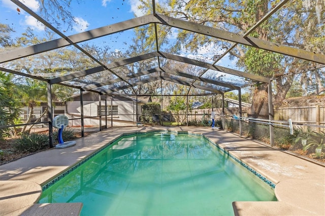 view of swimming pool with a lanai, a patio area, a fenced backyard, and a fenced in pool