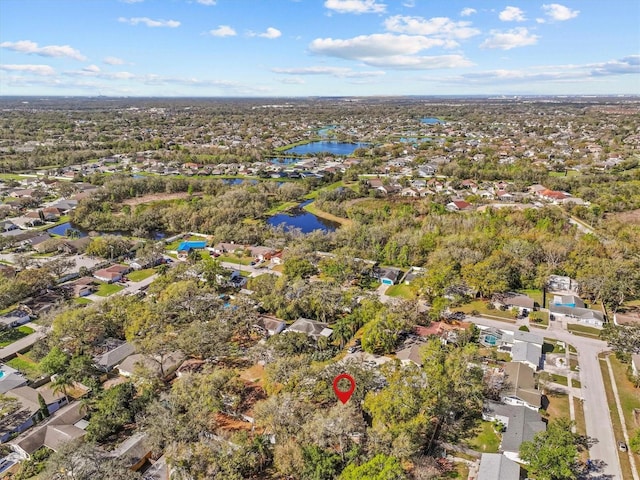 bird's eye view featuring a water view and a residential view