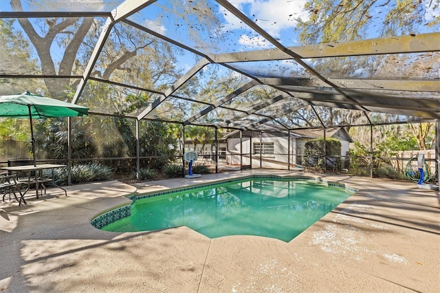 pool featuring a lanai and a patio area